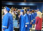 CCLP/DAVID J. HARDIN - Crossroads High School graduates walk into the Lea Ledger Auditorium during last Thursday’s Fall 2016 commencement ceremony. 25 students re-ceived their diplomas.