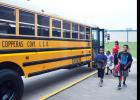 CCLP/TRAVIS MARTIN - Students return by the bus load to Clements Parsons Elementary School for the start of a new year.