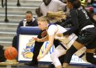 CCLP/TJ MAXWELL - Copperas Cove sophomore Madison Griffon falls to the floor after colliding with Ellison defenders Dalia Planas (2) and Madison Hattix-Covington in the third quarter of the Lady Dawgs’ 52-45 loss to the Lady Eagles Friday at Bulldawg Gymnasium.