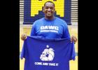 Courtesy Photo - Copperas Cove High School basketball coach Billy White holds up one of the tshirts with the motto of his hometown of Gonzalez. The educator is using the slogan, “Come and Take It” to motivate his players while teaching them history and character education simultaneously.