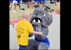Connor Hedge meets the Copperas Cove Bulldawg Mascot at the send-off rally for him on Monday