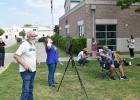Patrons of the Copperas Cove Public Library watch the total solar eclipse on Monday afternoon. (Photo by Pamela Grant)