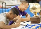 CCLP/DAVID MORRIS - Copperas Cove seniors Devante Robinson, left, and Malyk Thomas participate in a signing ceremony at the high school on Tuesday. Robinson will join former teammate Montre Williams at Division II Northeastern State in Oklahoma. Thomas will play basketball for the NAIA Kansas Wesleyan Coyotes