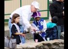 CCLP/WILLY ORTIZ- Jasper Johnson help kids at the annual Fishing in the Park event held on Saturday at city park.