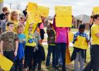 CCLP/DAVID J. HARDIN - House Creek Elementary students hold up signs in support of Connor Hedge during the sendoff rally.