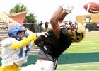 CCLP/TJ MAXWELL - Cove senior corner back Marcus McRae breaks up a pass during the Dawgs’s scrimmage against Abilene on Aug. 19. The Dawgs get their season underway tonight against Mexico’s UANL.