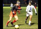 CCLP/TJ MAXWELL - Belton junior Mattie Krenek attempts to drive past Cove junior Jordan Campbell during the Lady Tigers 9-1 win over the Lady Dawgs Tuesday night in Cove. The Lady Dawgs fall to 3-3-2 with the loss while the Lady Tigers remain undefeated in 12-6A play at 7-0-1.