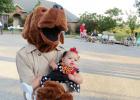 CCLP/DAVID J HARDIN - McGruff the crime dog holds little Skylar at the National Night Out Block party on Kim Avenue, held Tuesday October 3rd, the annual National Night Out Program is designed to build a partnership between neighbors and the police.