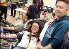 CCISD/Courtesy Photo - CCHS student Vivian Cohn clutches the hand of fellow student Victoria Zabatta while giving blood during the school’s bi-annual blood drive hosted by HOSA. The school collected 172 units of blood and has collected the most units of all of the Central Texas schools for the last four years consecutively.