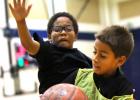 Tashaun Brown, 8, defends Ben Izquierdo, 8, during five-on-five play as part of the the 2014 Bulldawg Basketball Camp on Wednesday at the high school.