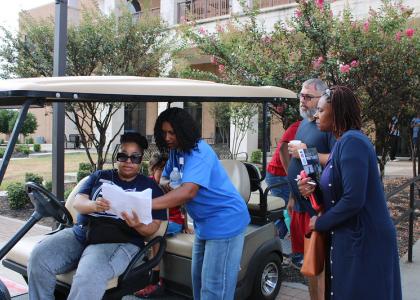 Central Texas College team members Lacriesha Wills and Erica Burton review the campus map with prospective students before escorting them to academic departments during Eagle Experience Day