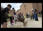 Members of the Holy Family Catholic Church turn dirt during a ceremony marking the expansion of their campus