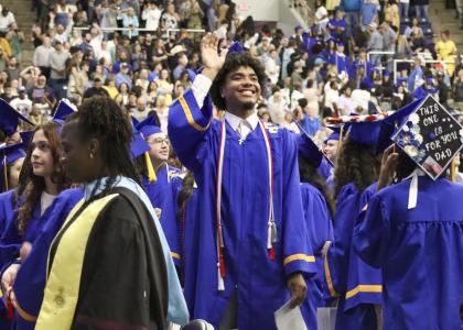  Graduating senior Marcus Rivera smiles and waves to his family during the Friday, May 22, Copperas Cove High School graduation ceremony.