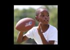 Eight-year-old Malik Davis competes in the NFL Punt, Pass and Kick competition Saturday at Copperas Cove City Park. Davis won the 8-to-9 yearold boys division.