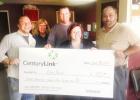 CenturyLink employees Becky Bennett, Jason Loden, Kallie Patterson and Greg Bolenbeck, presented a check for $475 to Cove House Executive Director Benjamin Tindall (left). The donation represents approximately 3,500 meals for the community.
