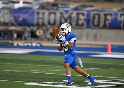Bulldawgs run the field with the ball on Friday evening. 