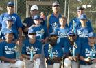 The 12U Cove Royals pose with the District Champion trophies after dominating the field in he District 4 12U Texas Teenage Baseball Tournament last week in Lampasas. The Royals out-scored their opponents 48-2 en route to the title.