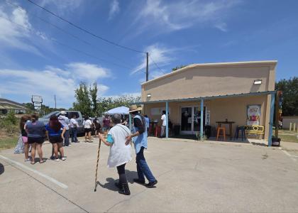 Copperas Cove residents line up to receive free food and water from local businesses amid water crisis.