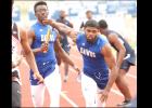 CCLP/TJ MAXWELL- Copperas Cove junior Eric Cain hands off to junior Kylan Herrera for the second exchange of the 4x200m relay during the Bulldawg Relays held Saturday.
