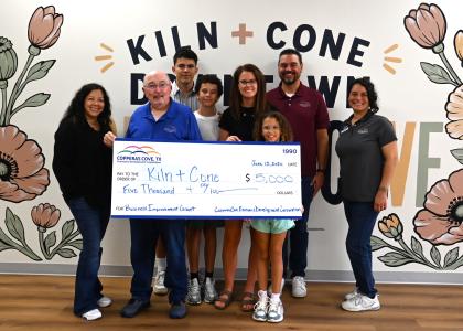 Ashley Lyons, owner of Kiln + Cone, is pictured with the Copperas Cove EDC staff and a $5,000 grant check. The grant funds are matching funds that were used to renovate Kiln + Cone, set to open this summer in downtown Copperas Cove.. 