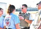 Manor High School juniors Katley Ramirez and Reyna Villalovos speak to Coryell County Sheriffs Rob Atkins and Eddie Rodriguez after their felony traffic stop competition Saturday at Copperas Cove High School.