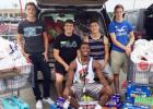 Members of the Copperas Cove DECA program pose with a portion of the 500 pounds collected during their backpacks food drive at Wal-Mart on Saturday. The collection will keep the shelves stocked through December.