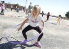 Martin Walker first grader Caitlyn Ervin spins her hoop as she participates in the Hot Chips and Hoops event Friday.