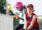 10U Diamondbacks third baseman Brooklyn Thompson waits on the throw as Marlins’ Jayna Carrero safely reaches base during their Copperas Cove Parks and Recreation league game Wednesday at city park.