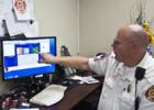Emergency Management Coordinator and Deputy Fire Chief, Gary D. Young views the weather station data from his computer in his office.